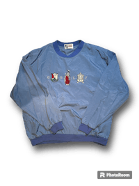 a blue sweatshirt with an image of a flag on it