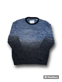 a blue and black sweater on a black background