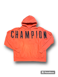 an orange hoodie with the word champion on it