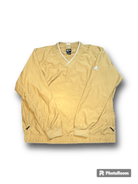 a yellow v - neck sweater on a black background